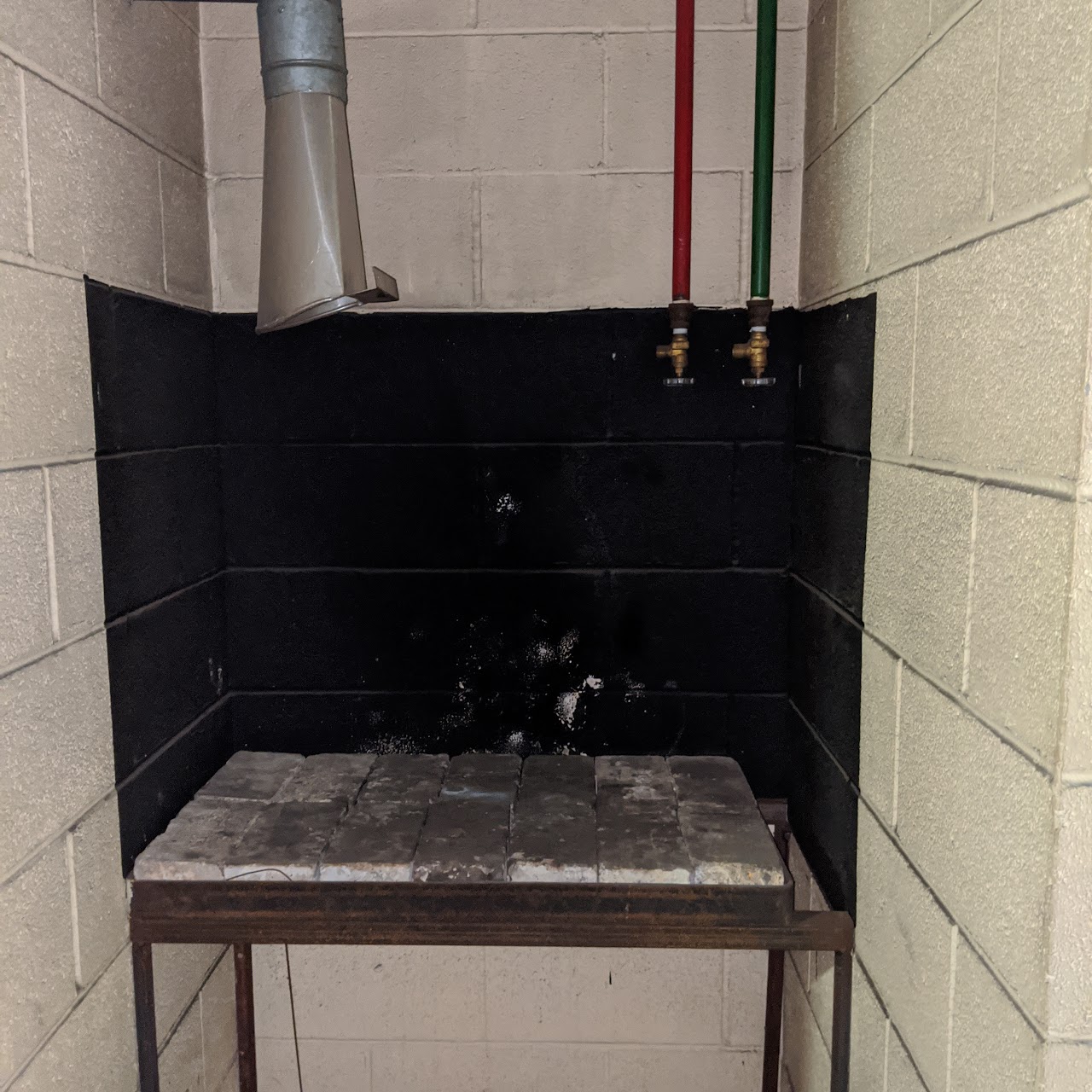 Earlier photograph of the welding bay; not current condition